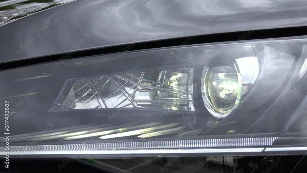 A detailed view of a front car xenon light, view from the side of the car. A detailed view of a front car xenon light, view from the side of the car.