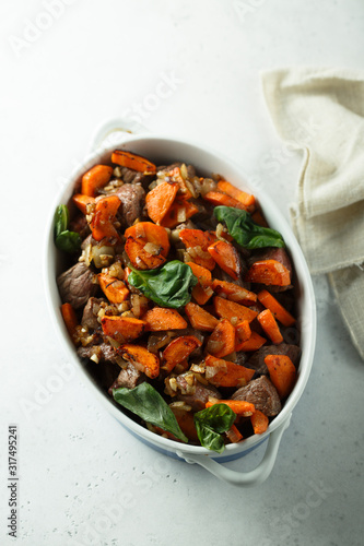 Roasted beef with carrot and green basil