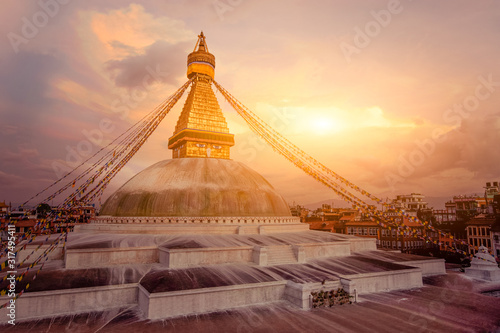 Buddhist Shrine Boudhanath Stupa with pray flags over sunset sky. Nepal  Kathmandu