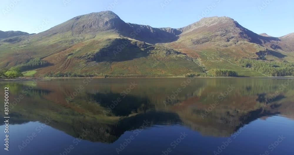 The Lake Buttermere pines and peaks of High Crags, Lake District National Park, Cumbria, England, United Kingdom, Europe The Lake Buttermere pines and peaks of High Crags, Lake District National Park, Cumbria, England, United Kingdom, Europe