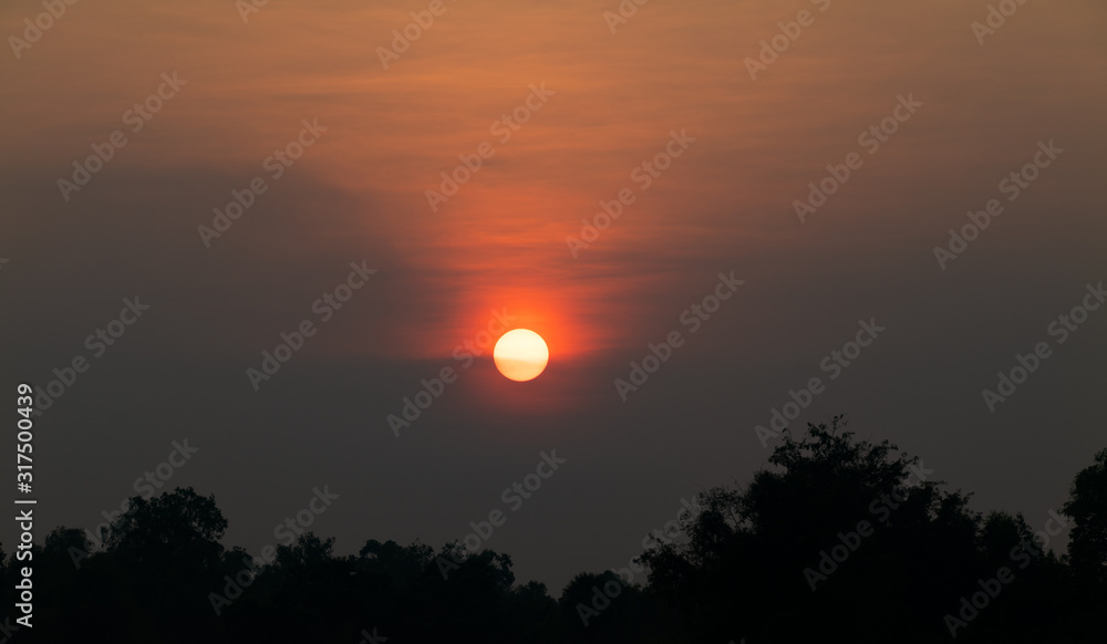 Sunset orange sky background at evening with clouds Sunset orange sky background at evening with clouds