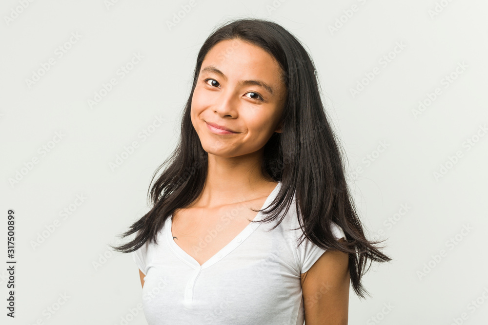 Young chinese woman posing on a white background Young chinese woman posing on a white background