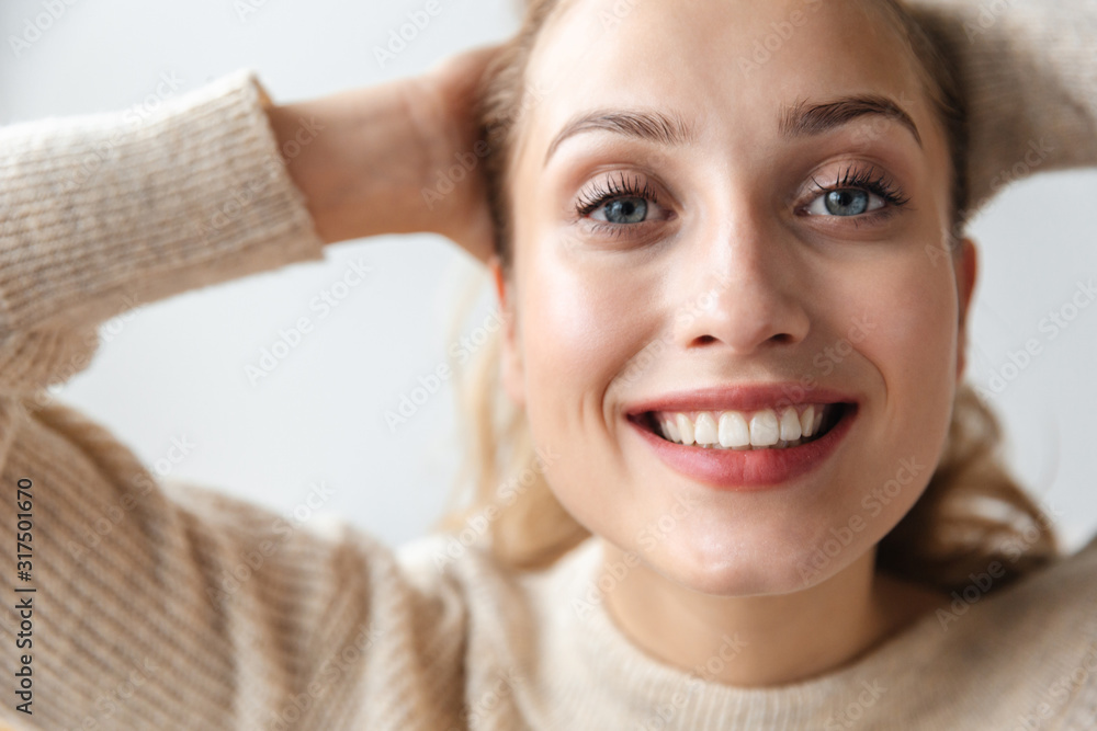 Positive optimistic young woman posing indoors at home. Positive optimistic young woman posing indoors at home.