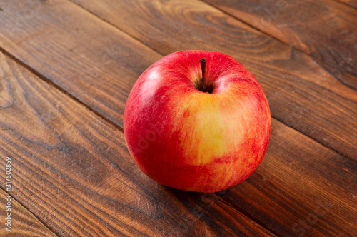 red apple on wooden background