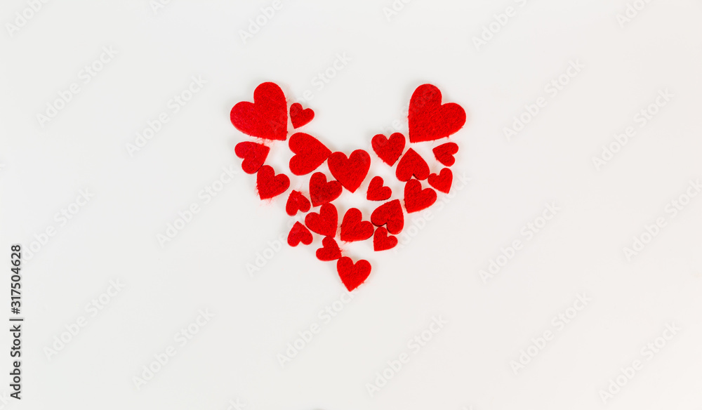 Red heart shapes on white background for Valentine's Day.