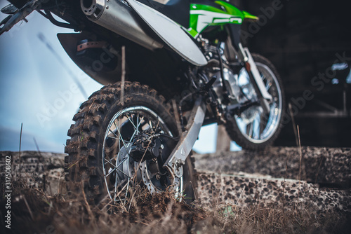 Action the wheel of an Enduro Motorcycle Hits an obstacle in the ground © komokvm