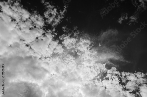Black and white cloud pattern with a deep black sky