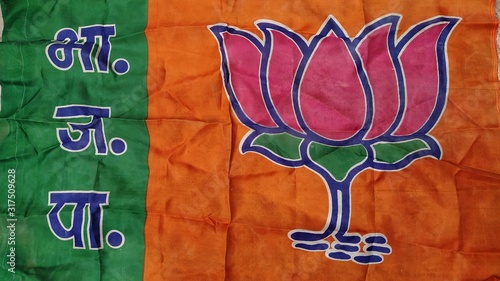 New Delhi, Delhi/India- January 21 2020: Flag of a political party contesting election in india. Lotus on orange and green color is the symbol of BJP.