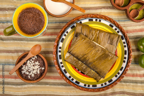 Canvas Print Oaxacan tamal made of corn chicken pork and chili