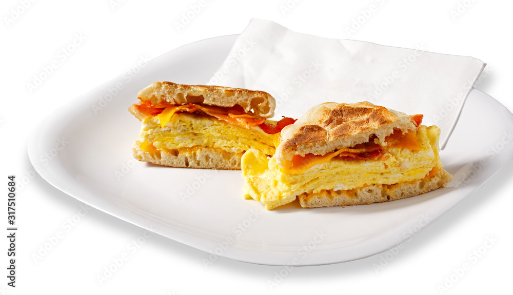 Bacon, egg, and cheese sandwich on an English Muffin with clipping path Bacon, egg, and cheese sandwich on an English Muffin with clipping path