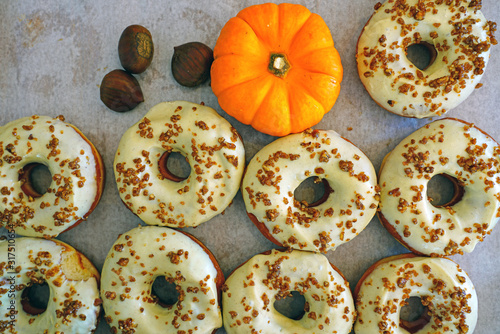 Fresh pumpkin donuts with white icing
