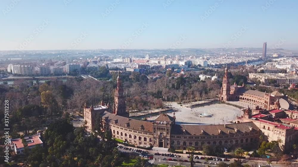 Aerial view of beautiful Espana Square in centre of Seville. Panoramic view over the city. View of River Guadalquivir and beautiful park of Maria Luisa. Aerial view of beautiful Espana Square in centre of Seville. Panoramic view over the city. View of River Guadalquivir and beautiful park of Maria Luisa.