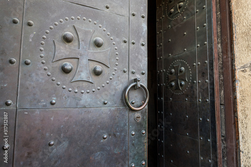Side copper-clad door to the Svetitskhoveli Cathedral in the Mtskheta city in Georgia