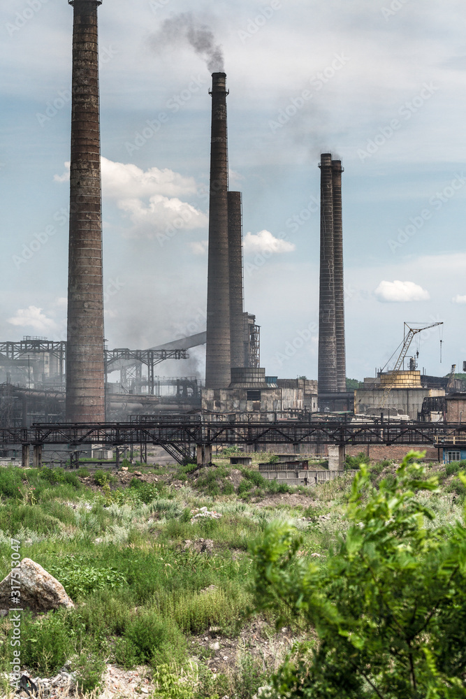 The largest air pollutant in city Dnipro Ukraine is coke-chemical plant. Flue gas stacks emit hundreds tons of harmful substances a years into the atmosphere. Industrial landscape.