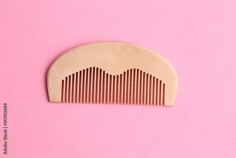 wooden comb in color background wooden comb in color background