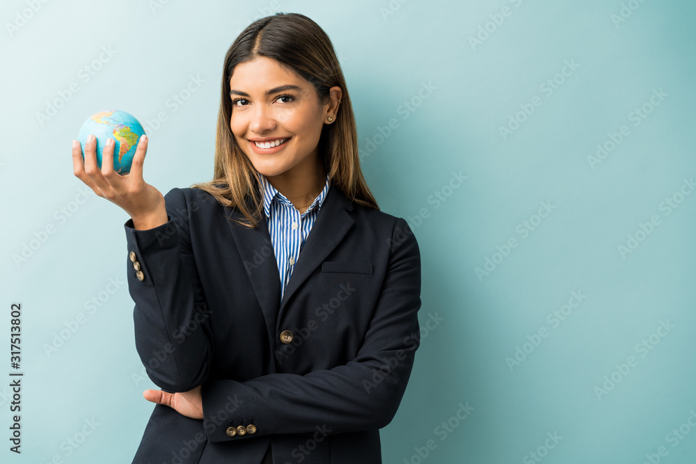 Confident Businesswoman Standing With World Map Confident Businesswoman Standing With World Map