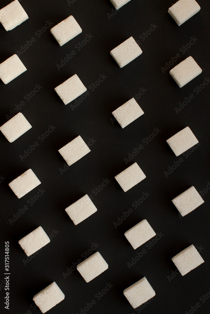 white sugar cubes pattern on black background white sugar cubes pattern on black background