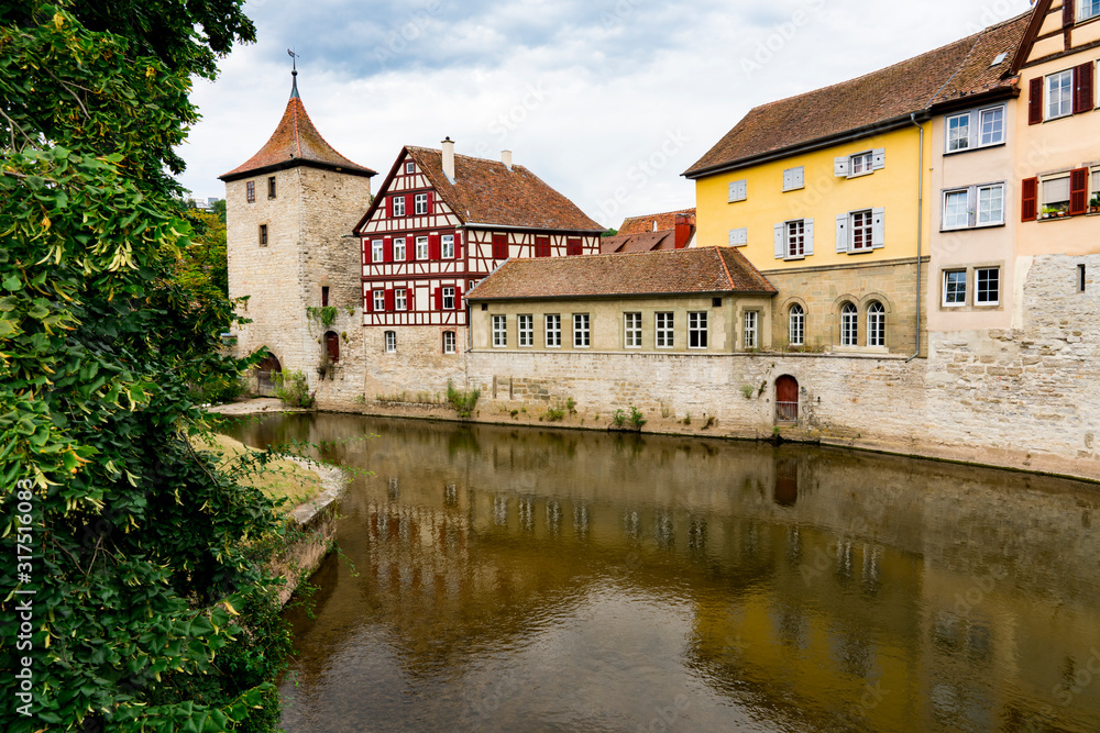 Half timbered housed and tower along river Kocher in Schwabisch Hall, Germany