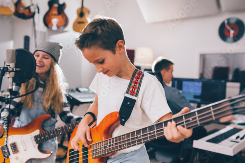 Canvas-taulu kids rock band playing in studio