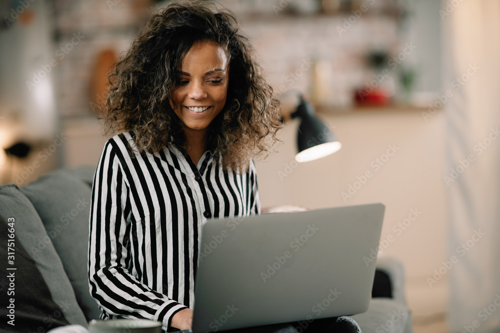 Beautiful mixed race student studying online. Businesswoman working from home. 