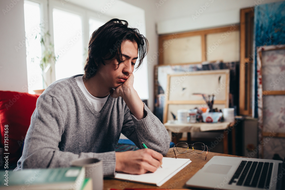 young man freelancer working in his room, young man freelancer working in his room,