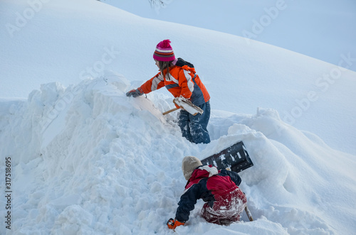 children playing in the snow