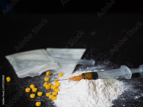 Substance abuse with Ketamine, syringe, Amphetamine. photo