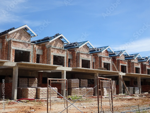 Wallpaper Mural New double story luxury terrace house under construction in Malaysia.  Designed by an architect with a modern and contemporary style.  Torontodigital.ca