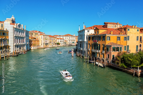 The Grand Canal of Venice, boats and handballs go along the canal.