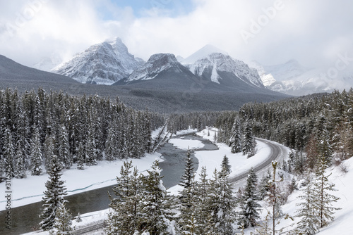 Winter view of Morant’s Curve on the railway though Banff National Park, Alberta, Canada