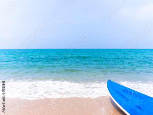 Blue kayak floating on blue sand with blue sea. Relax in holiday at sea thailand concept.