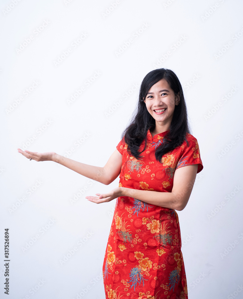 beautiful asian girl in chinese traditional dress presenting copy space beautiful asian girl in chinese traditional dress presenting copy space