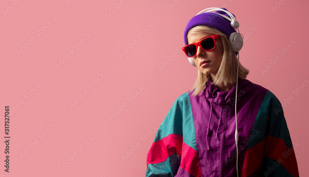 woman in 90s clothes with sunglasses and headphones