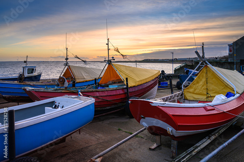Boatyard at Newbiggin-By-The-Sea, which is a small town in Northumberland, England, on the North Sea coast photo