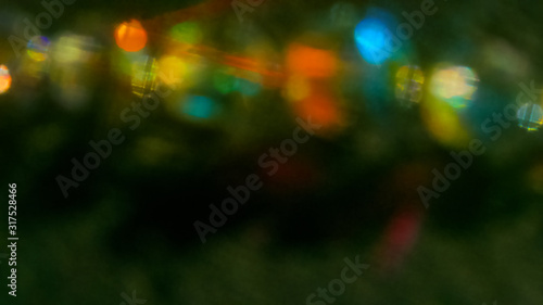 Multicolored light reflections on a black background. Surrealistic image. Abstract image.