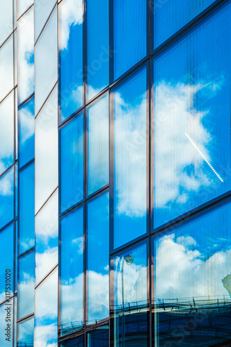 Reflections of the sky in the glass facade of the building