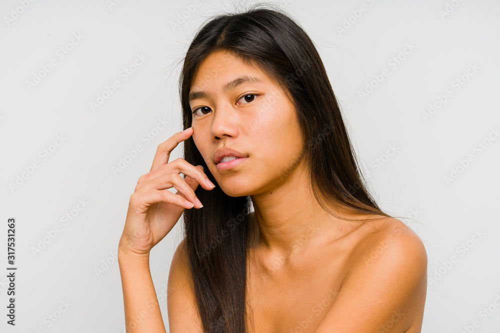 Young chinese woman face close up isolated Young chinese woman face close up isolated