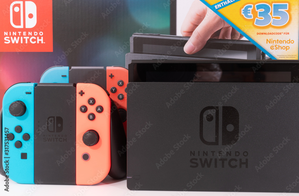 Nintendo Switch video game console developed by Nintendo, released on March  3, 2017 on a white background. Germany, Berlin - June 30, 2019: Nintendo  Switch Joy-con controller on a white background Stock Photo | Adobe Stock