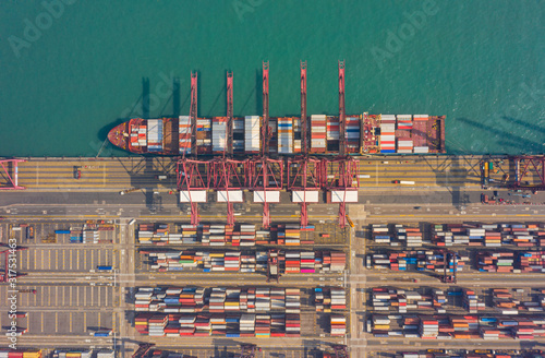 Top view of international port with Crane loading containers in import export business logistics at Hong Kong in China