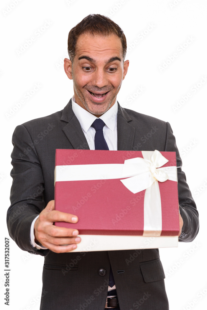 Happy mature Persian businessman opening gift box ready for Valentine's day Happy mature Persian businessman opening gift box ready for Valentine's day