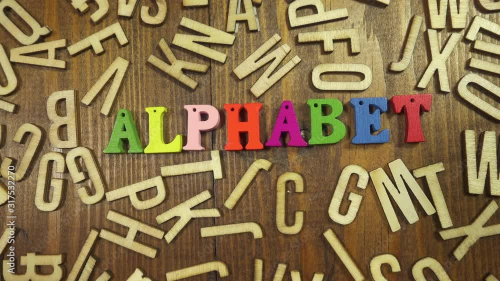 Pan over the alphabet spelt out in wooden letters. Pan over the alphabet spelt out in wooden letters.