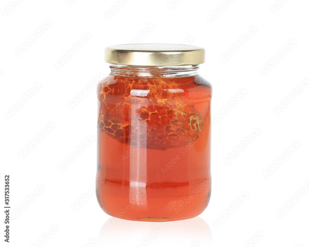 Honey from nature pollen flower in glass bottle isolated on white background. This has clipping path. Honey from nature pollen flower in glass bottle isolated on white background. This has clipping path.