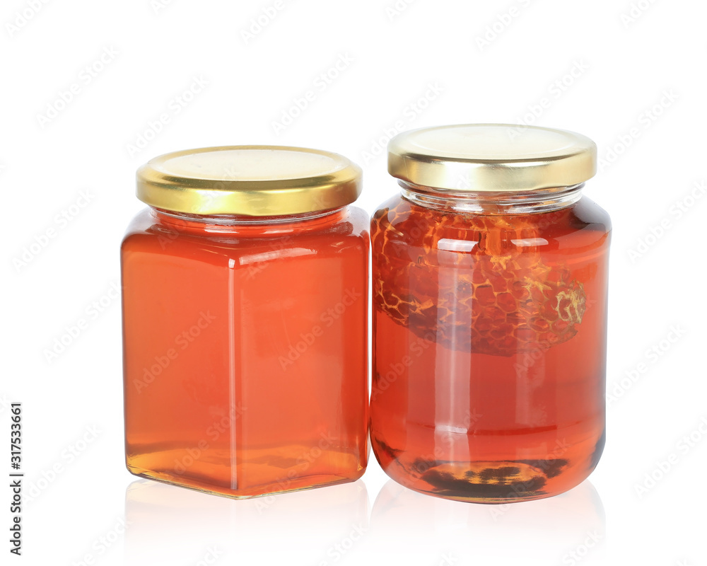 Honey from nature pollen flower in glass bottle isolated on white background. This has clipping path. Honey from nature pollen flower in glass bottle isolated on white background. This has clipping path.