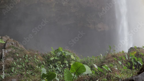 Translation:Phu Cuong waterfall A flying camera captures a waterfall in Vietnam photo