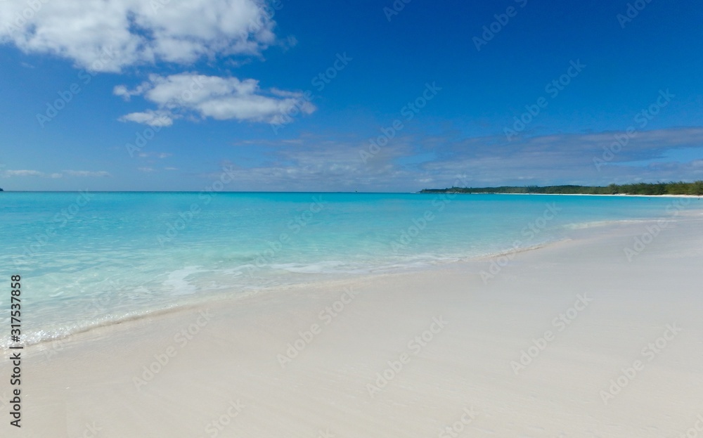White sand and aquamarine water of a Bahamas beach