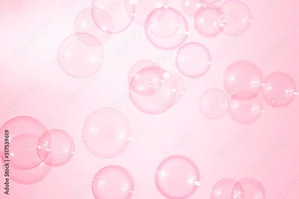 Beautiful pink soap bubbles float in the air, bubbles background
