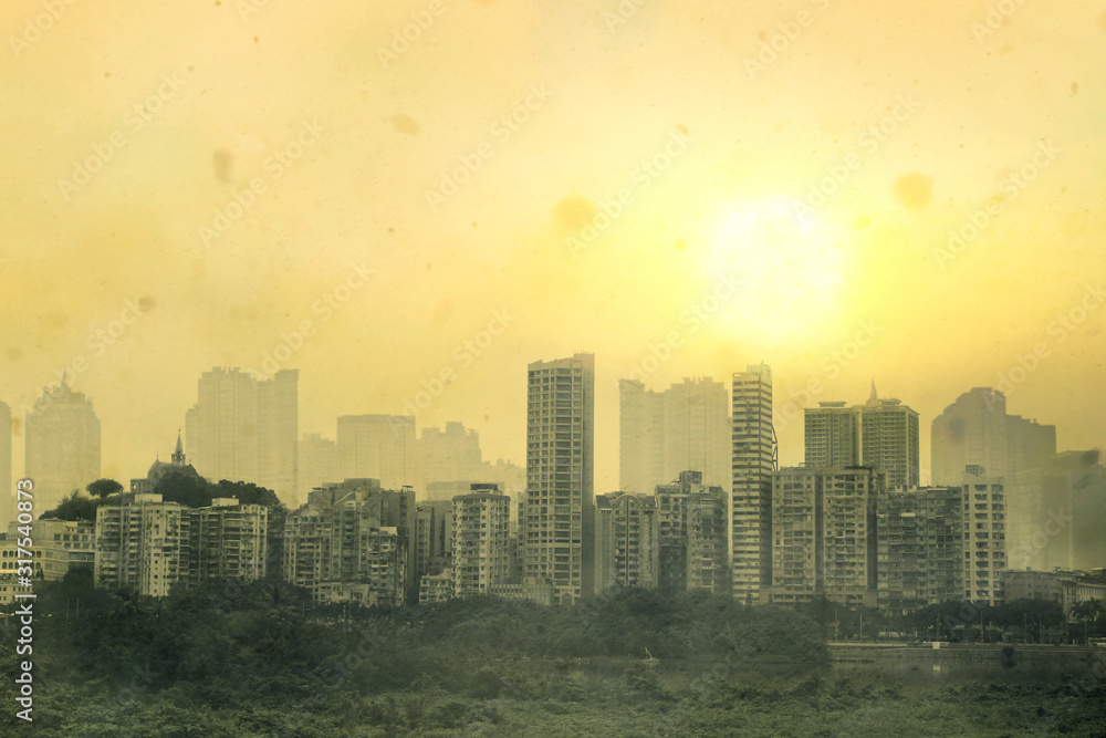 Obraz premium Cityscape of old urban building in Asia with bad air quality, covered by dust particles ,PM2.5,haze,fog,smog at sunset 