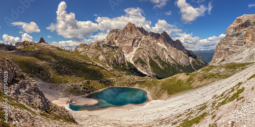 Lake beneath Punta dei Tre Scarperi in the Dolomite Alps, South Tyrol, Italy