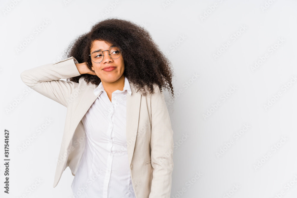Young african american business woman touching back of head, thinking and making a choice. Young african american business woman touching back of head, thinking and making a choice.