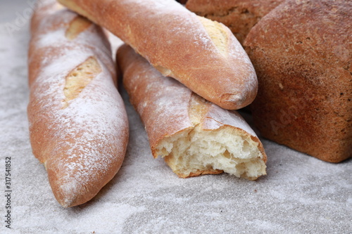 crispy appetizing baguette on the table © Тетяна Линник